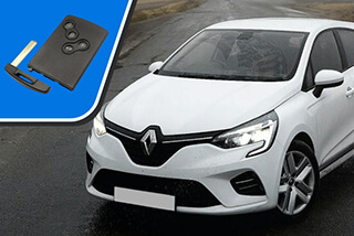 The front of a white Renault Clio car shown with a Renault Clio Key Card