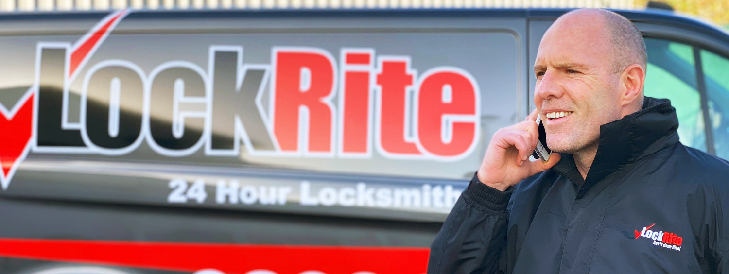 Surbiton locksmith stood beside LockRite branded van