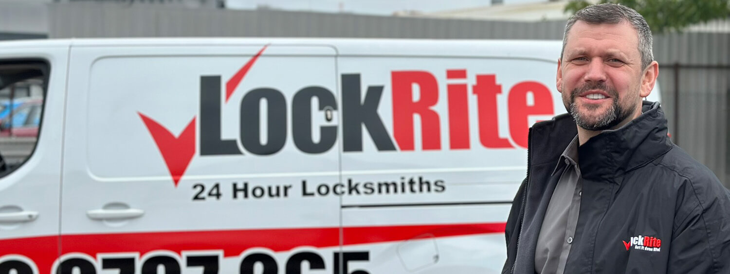 Boston locksmith stood beside LockRite branded van