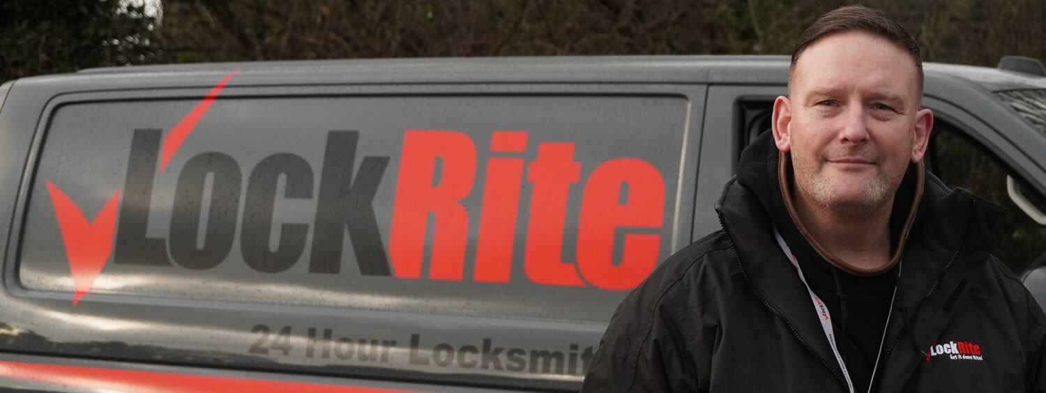 Falmouth locksmith stood beside LockRite branded van